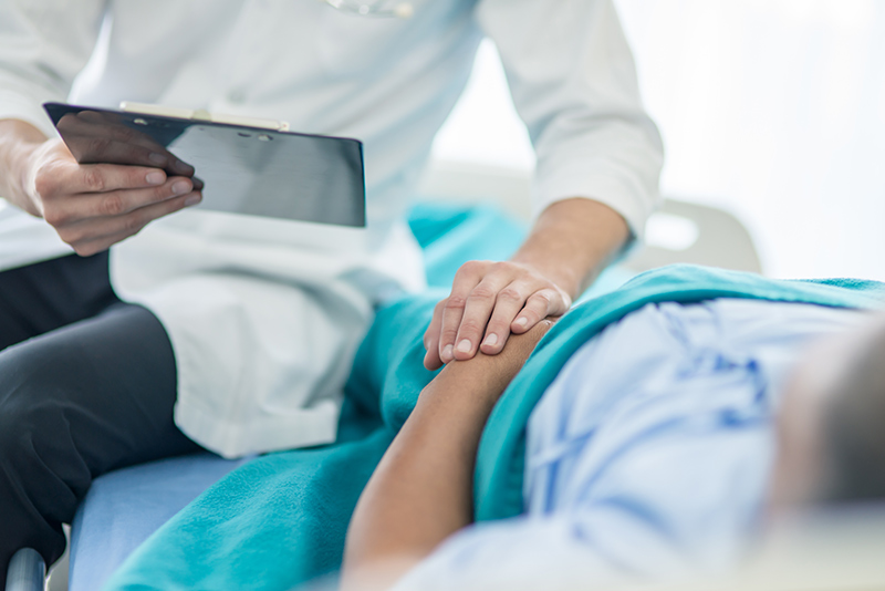 Doctor supporting a patient before an abortion.