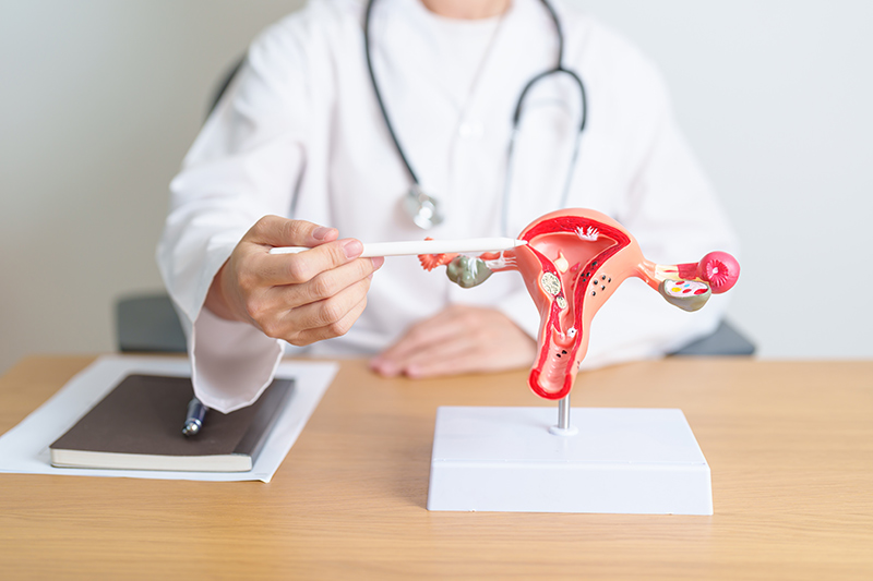 A woman suffering from significant abdominal pain.